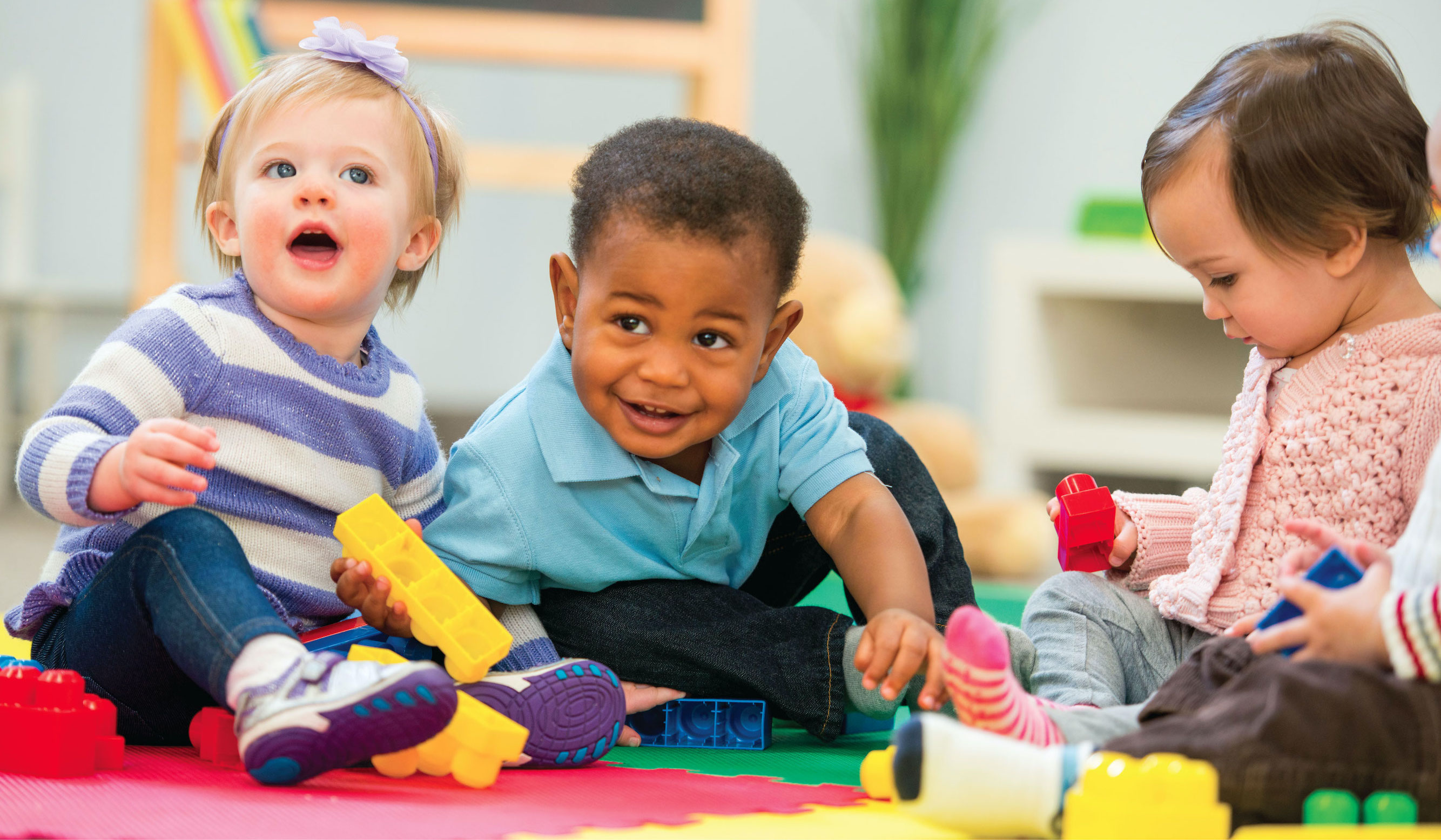  children playing in a classroom